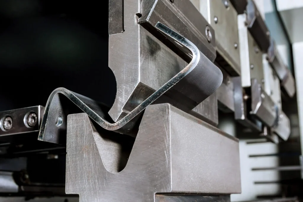 A machine cutting metal, producing bright sparks during operation.